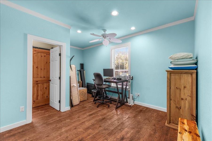 Office area with dark wood-type flooring, ornamental molding, recessed lighting, and ceiling fan