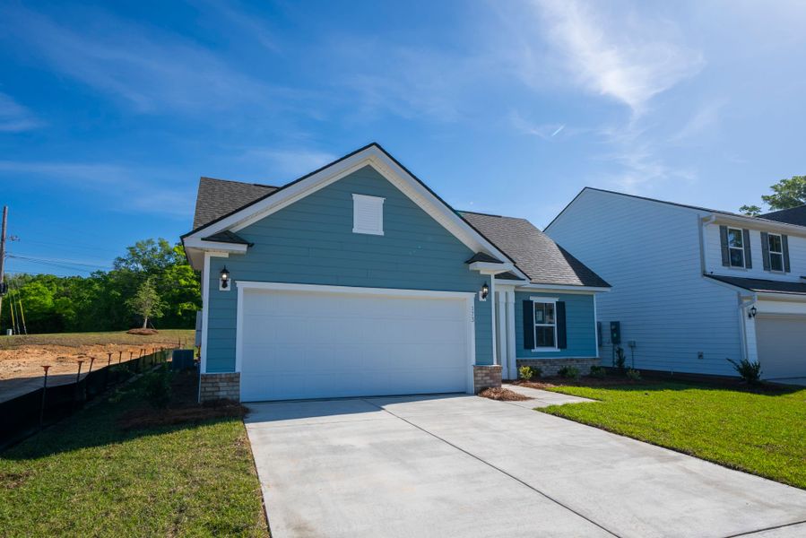Front exterior of a new home in Monroe Preserve, Chapin, SC, highlighting curb appeal (Image 25). Front exterior of a new home in Monroe Preserve, Chapin, SC, highlighting curb appeal (Image 25).