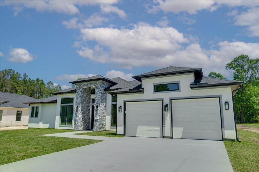 Front exterior of a new home in , Dayton, TX, highlighting curb appeal (Image 25).