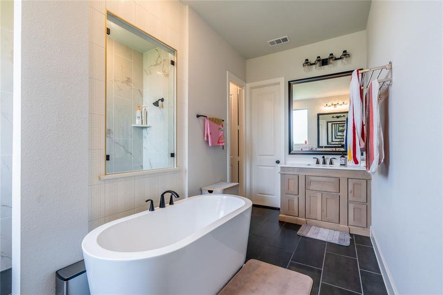 Bathroom featuring wood finished floors and baseboards