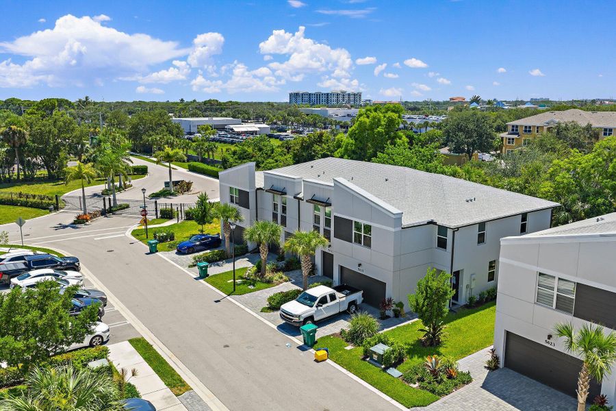 Front exterior of a new home in Enclave at Mangonia Park, West Palm Beach, FL, highlighting curb appeal (Image 1).