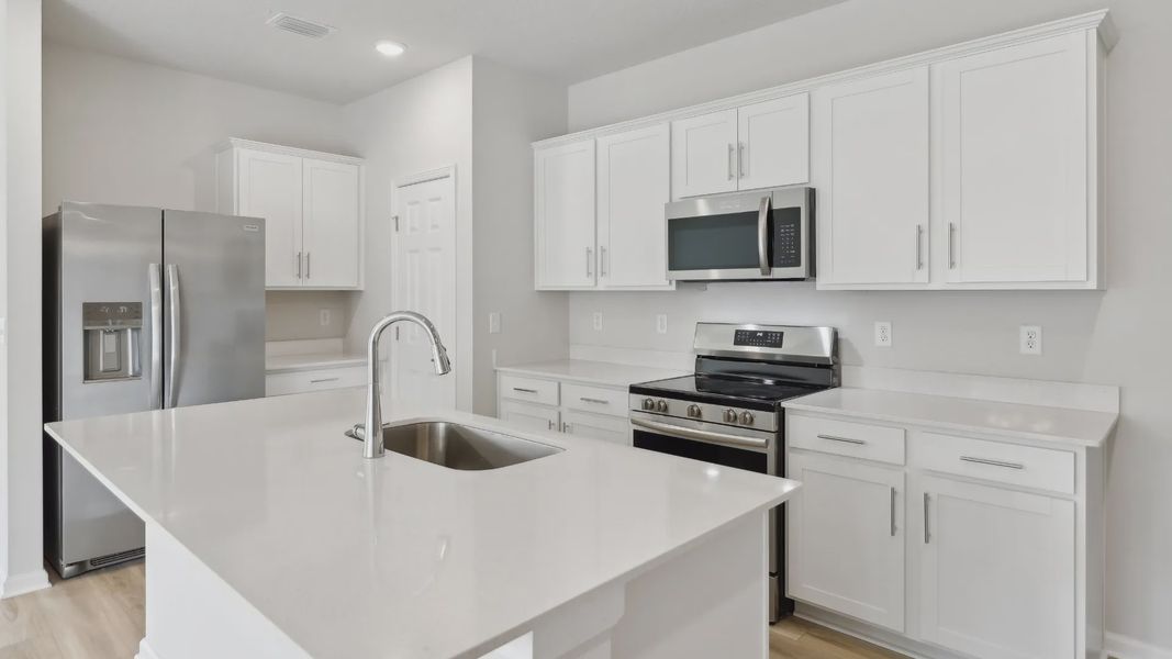 Sophisticated Palm Coast kitchen with sleek quartz countertops and premium stainless steel appliances.