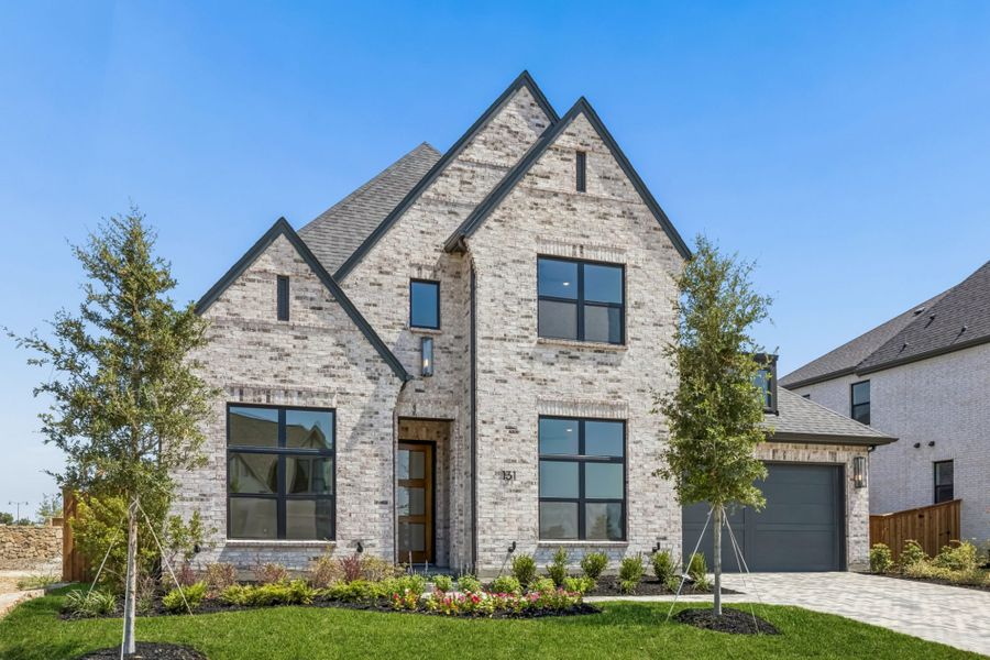 Front exterior of a new home in StarView, Prosper, TX, highlighting curb appeal (Image 2). Front exterior of a new home in StarView, Prosper, TX, highlighting curb appeal (Image 2).