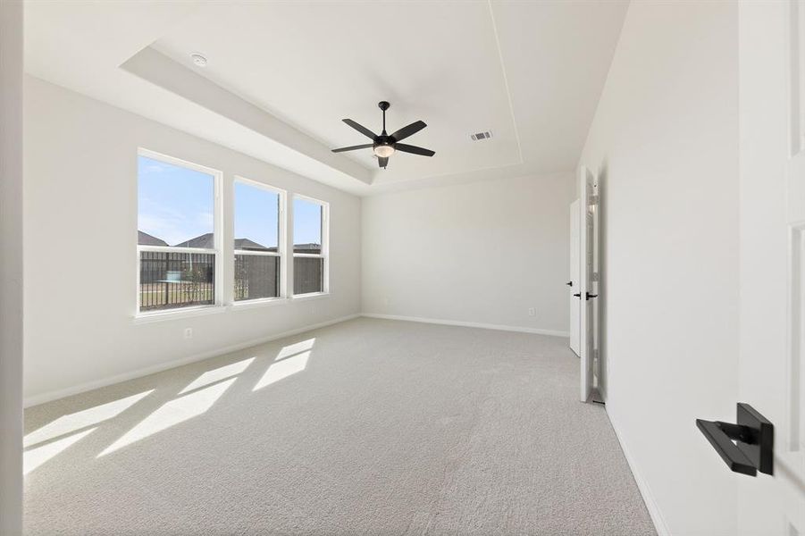 With high ceilings, oversized windows and plush carpeting, this owner's suite was designed for rest and relaxation.