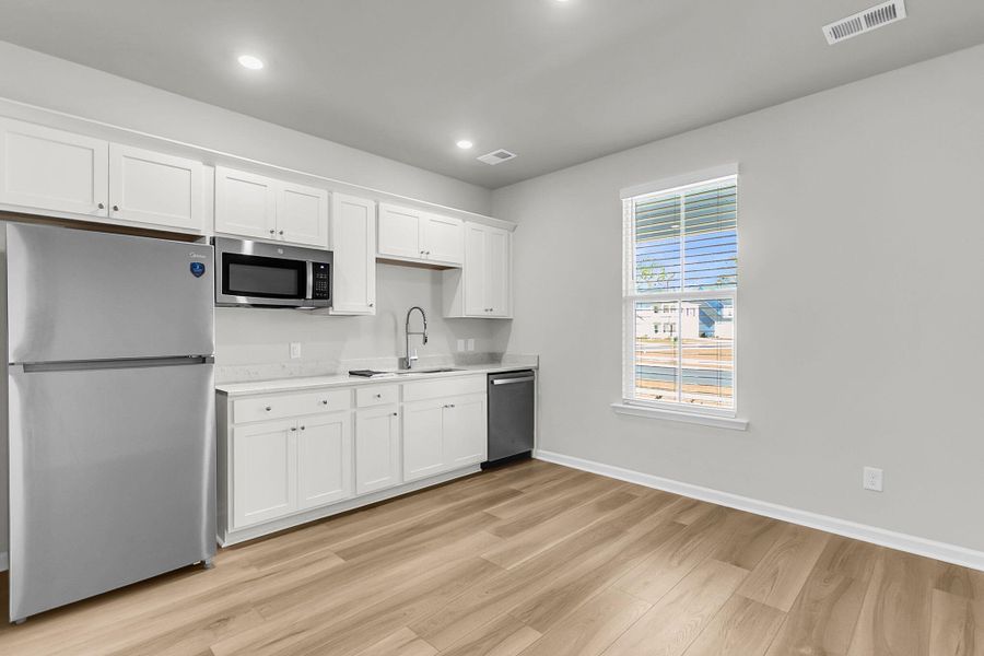 Furnished interior view inside a new home in Limehouse Village: Arbor Series, Summerville (Image 18).