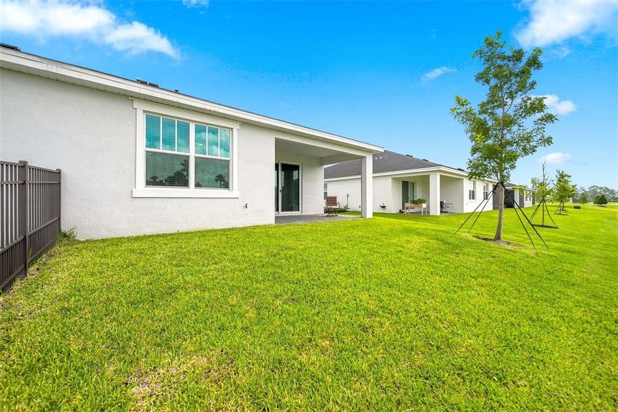 Exterior details and patio area of a home in The Timbers at Everlands, Palm Bay (Image 32).