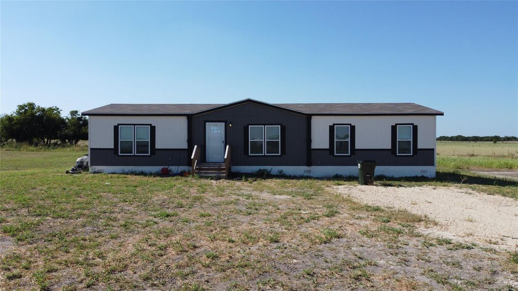 A well-maintained single-story residence with a tidy yard offers quiet country living. A well-maintained single-story residence with a tidy yard offers quiet country living.
