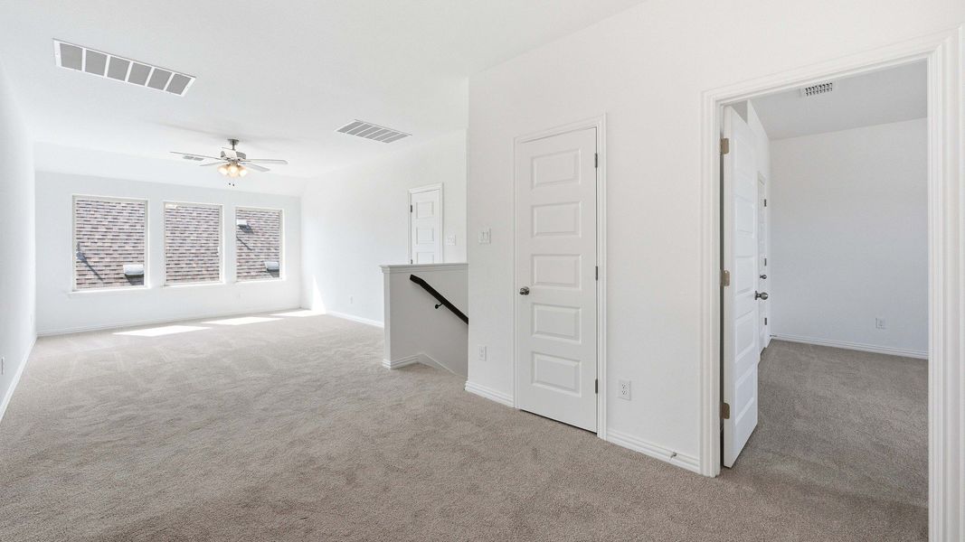 Furnished interior view inside a new home in Oaks at San Gabriel, Georgetown (Image 12).