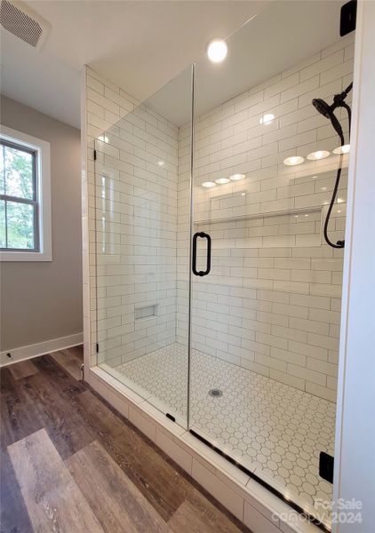 Sample Pic of Only the Tile Shower Installed (No Soaking Tub Installed) with Glass Doors in the Primary Bath- ALL pics are of previous builds and are for visual purpose only- Color Schemes Interior & Exterior will vary based on Builder's discretion.