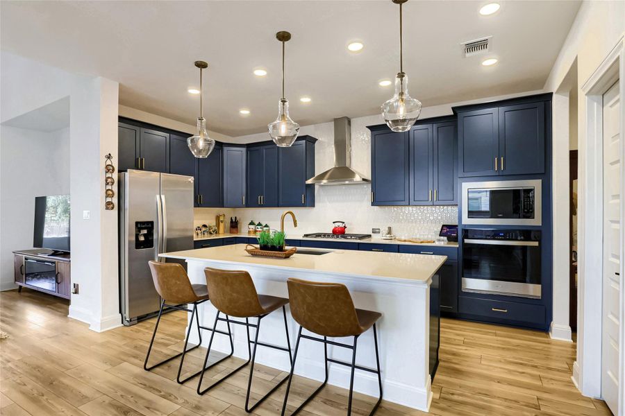 Culinary aspirations find their home in this well-appointed kitchen, featuring a central island and contemporary fixtures. Culinary aspirations find their home in this well-appointed kitchen, featuring a central island and contemporary fixtures.