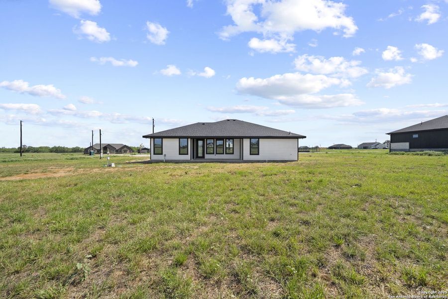 Front exterior of a new home in , Floresville, TX, highlighting curb appeal (Image 30). Front exterior of a new home in , Floresville, TX, highlighting curb appeal (Image 30).