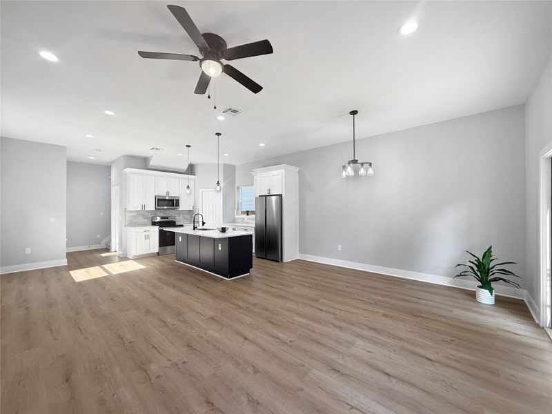 Elegant Formal Dining, Spacious Living Area, and Cozy Breakfast Nook seamlessly connected in an open-concept floor plan!