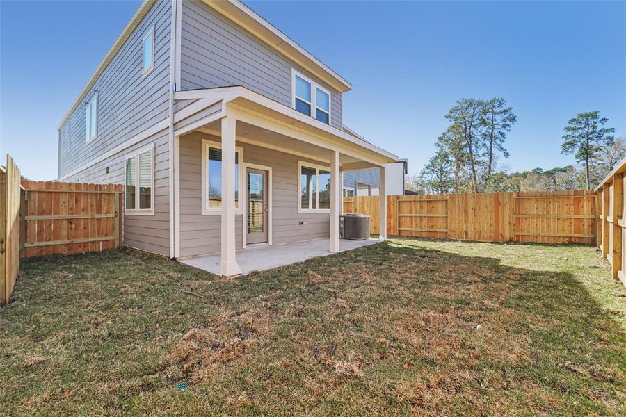 Exterior details and patio area of a home in Pinewood Trails - City Series, Atascocita (Image 21).