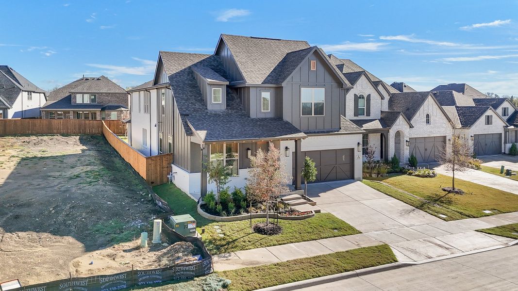 Front exterior of a new home in Aster Park, McKinney, TX, highlighting curb appeal (Image 27). Front exterior of a new home in Aster Park, McKinney, TX, highlighting curb appeal (Image 27).