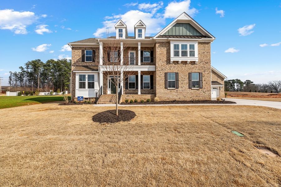 Front exterior of a new home in Walnut Grove, Easley, SC, highlighting curb appeal (Image 1). Front exterior of a new home in Walnut Grove, Easley, SC, highlighting curb appeal (Image 1).