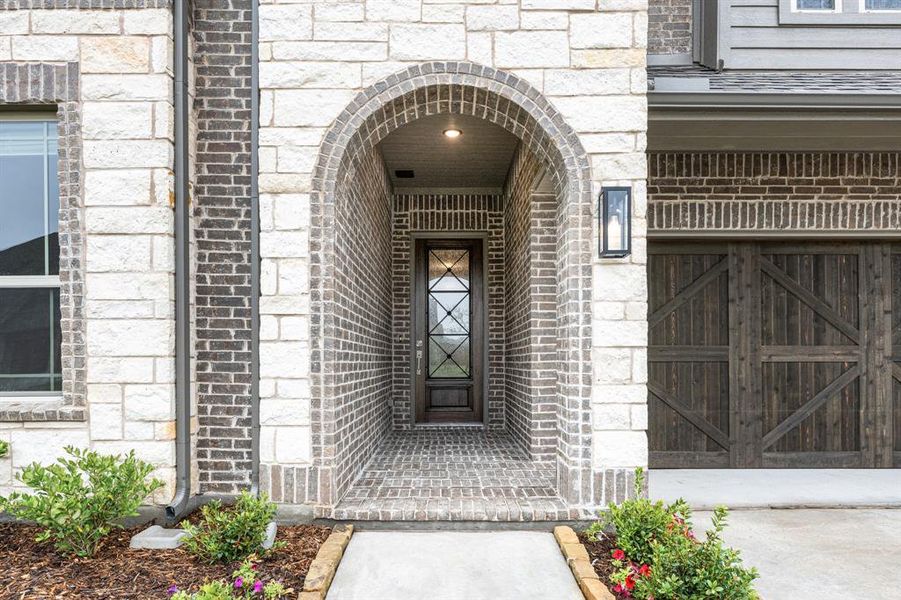 Exterior details and patio area of a home in Terracina, Rockwall (Image 28).