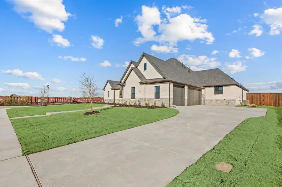 Front exterior of a new home in , Haslet, TX, highlighting curb appeal (Image 24).