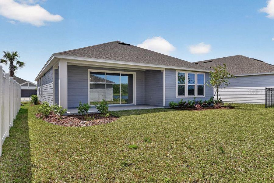 Exterior details and patio area of a home in Colbert Landings, Palm Coast (Image 3).