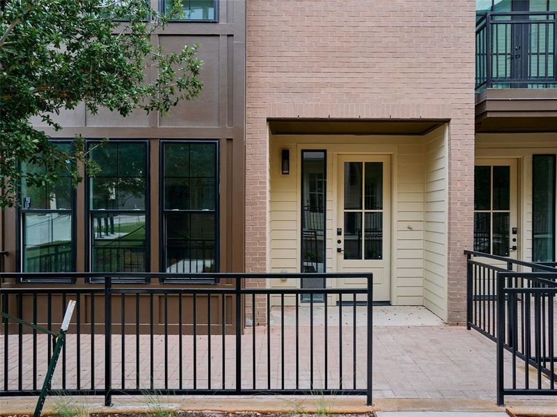 Contemporary exterior featuring a brick facade, board and batten siding, and an accessible ramp