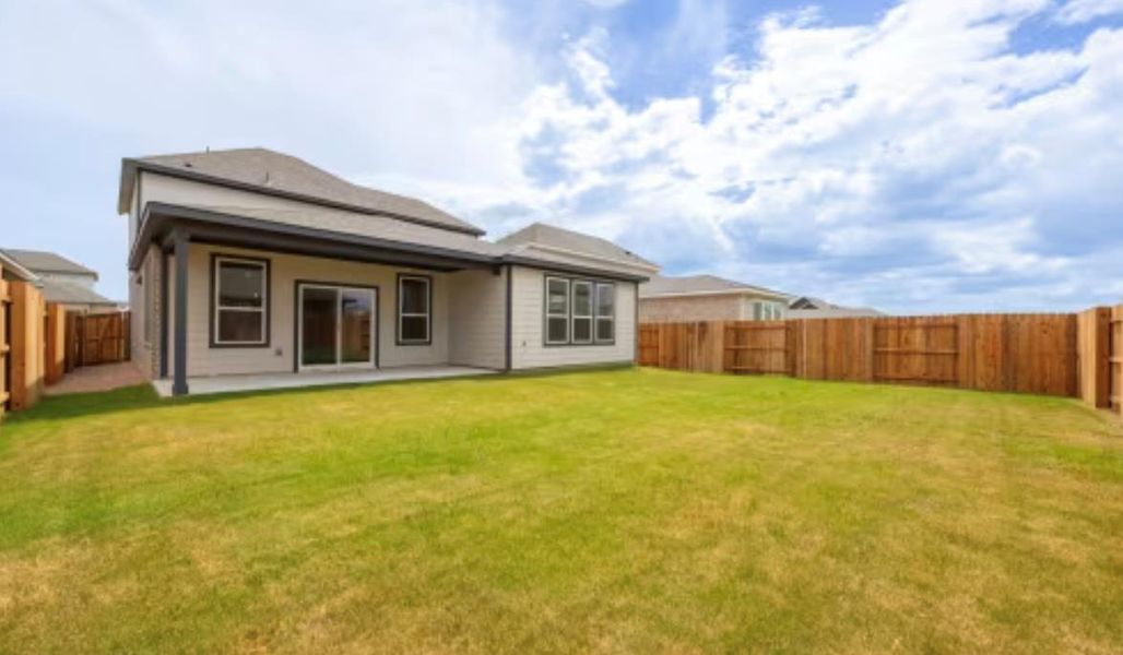 Front exterior of a new home in , Kyle, TX, highlighting curb appeal (Image 1).