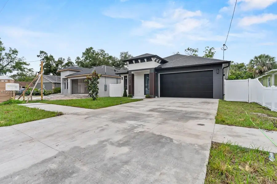 Front exterior of a new home in , Tampa, FL, highlighting curb appeal (Image 21).