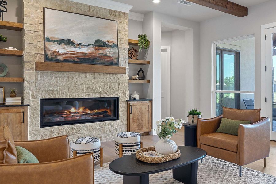 Living room with light wood-style floors, a fireplace, built in features, recessed lighting, and beam ceiling
