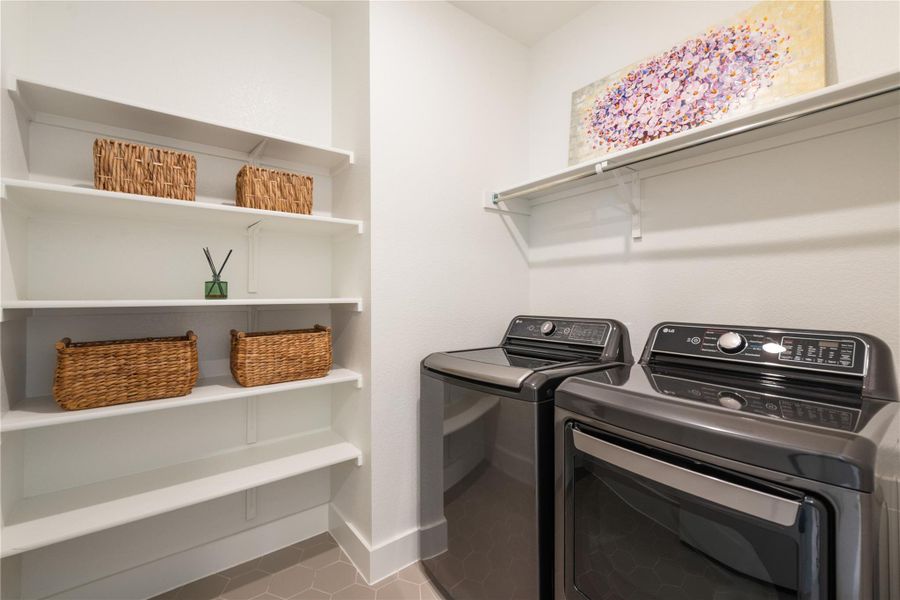 Spacious laundry room features ample shelving for organization. Waher/dryer convey. Spacious laundry room features ample shelving for organization. Waher/dryer convey.