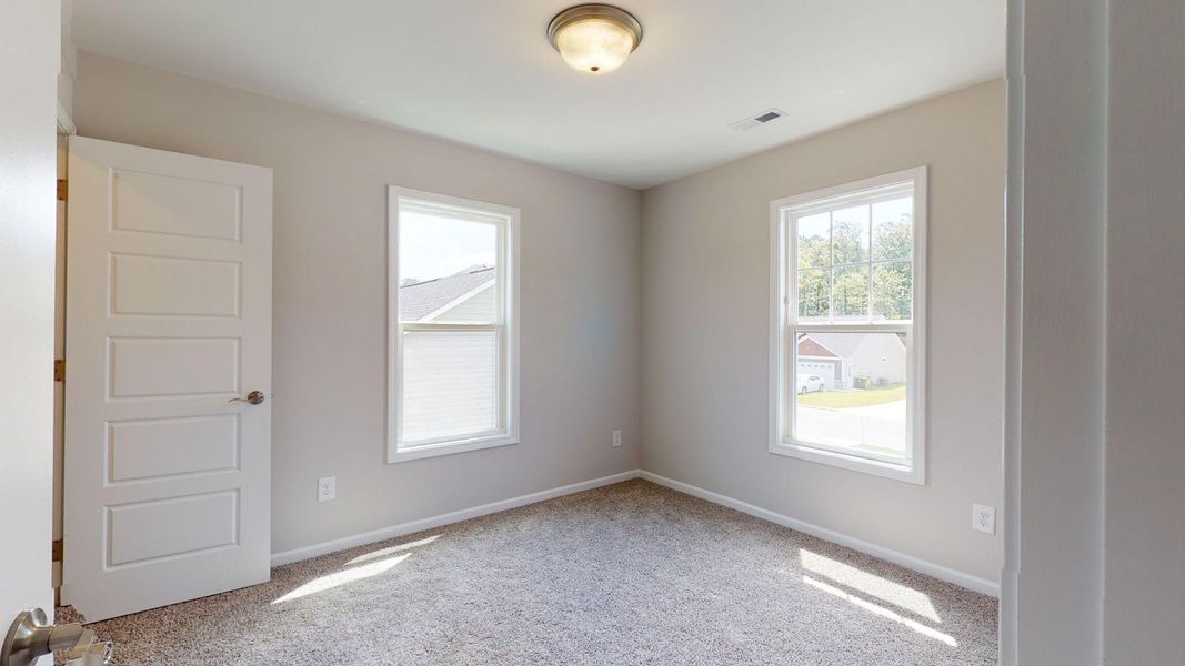 Representative unfurnished interior of a home built from the Tyler A by JC Jackson Homes,LLC in Heritage Pointe, Newport (Image 23).