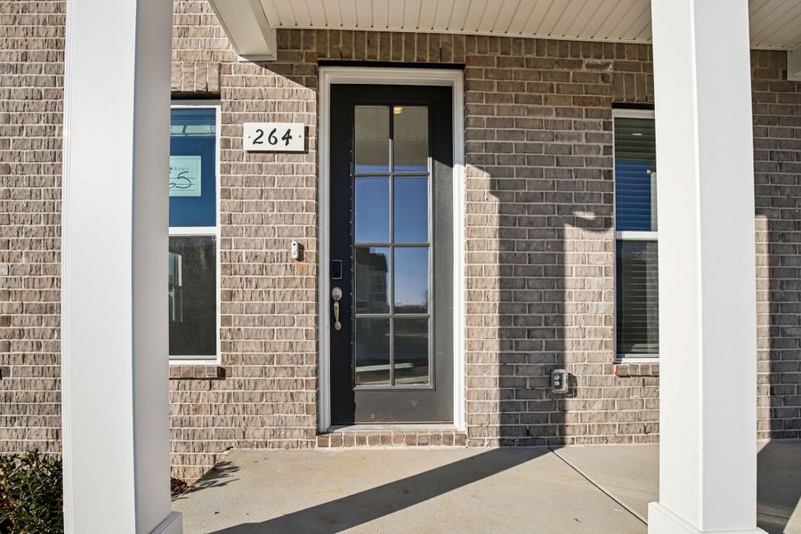 Exterior details and patio area of a home in Greystone - Vista Townhomes, Smyrna (Image 3).