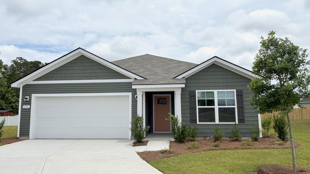 Front exterior of a new home in Dove Crossing, Conway, SC, highlighting curb appeal (Image 1).