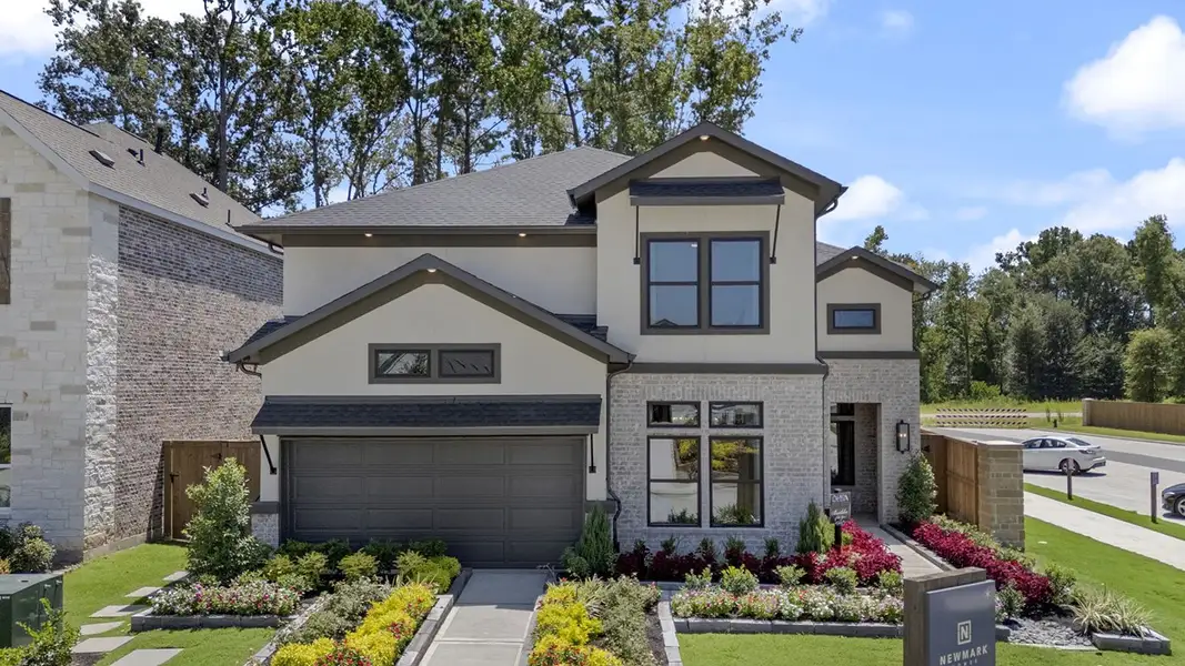 Front exterior of a new home in The Highlands 50', Porter, TX, highlighting curb appeal (Image 1).