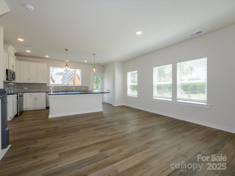 Spacious, unfurnished interior of a new home in Central Living at Craig, Charlotte (Image 29).