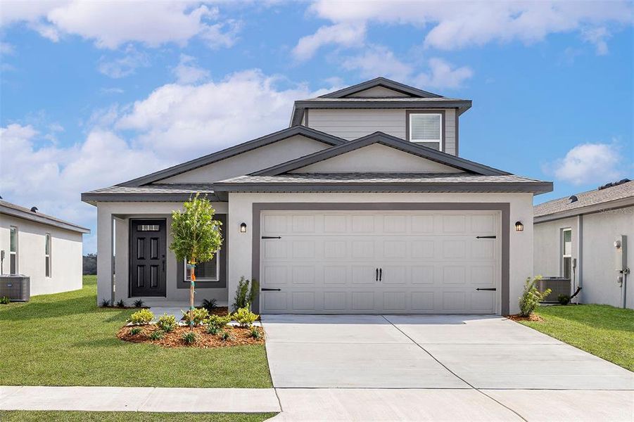 Front exterior of a new home in Spring Hill, Spring Hill, FL, highlighting curb appeal (Image 1).