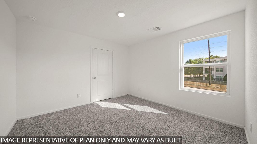 Neutral interior room featuring light gray carpeting and white walls