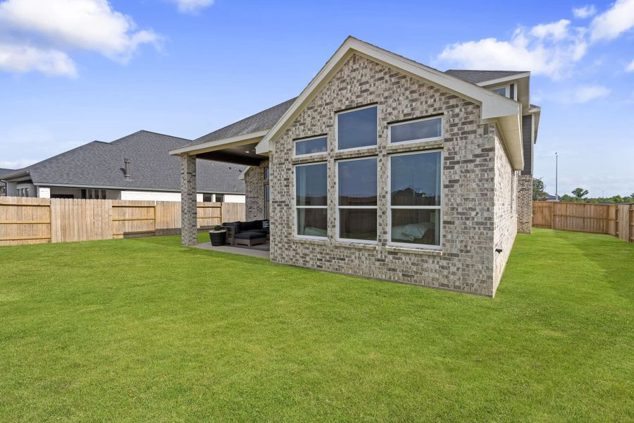 Exterior details and patio area of a home in The Highlands, Porter (Image 24).