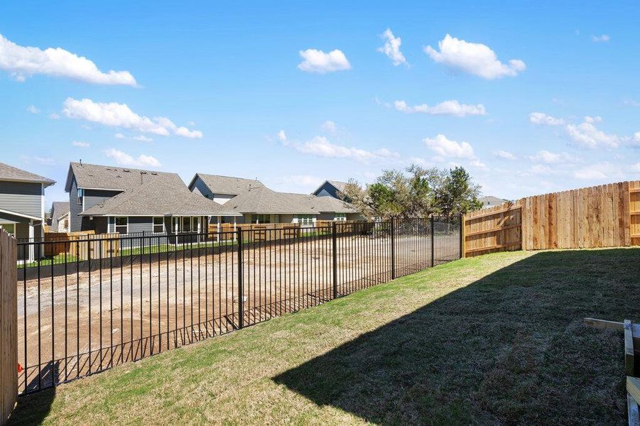 Exterior details and patio area of a home in Cannon Ranch, Dripping Springs (Image 24).