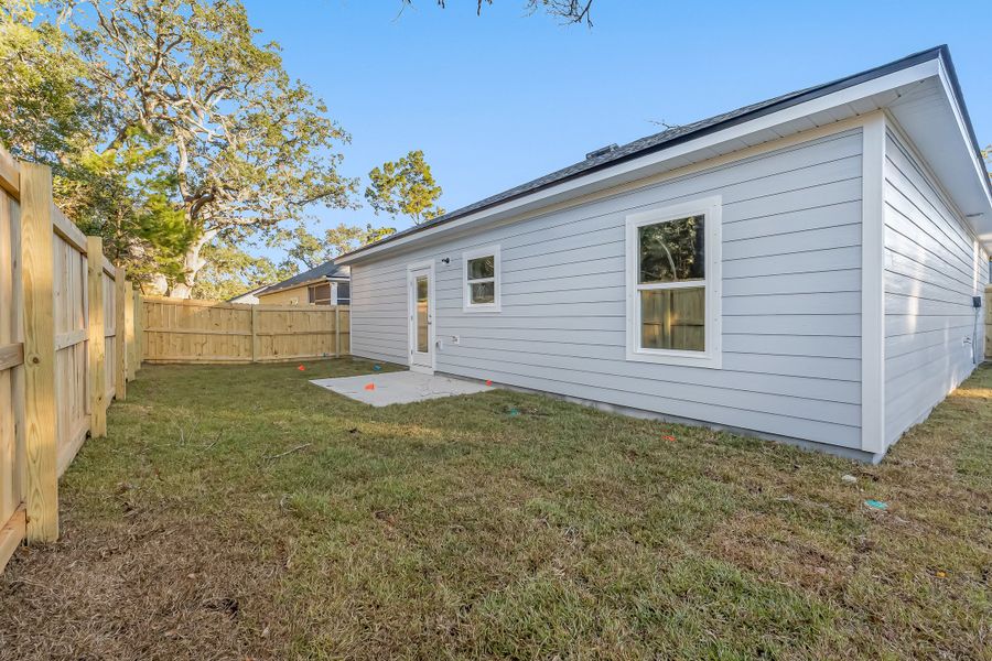 Exterior details and patio area of a home in Live Oak Cottages, Freeport (Image 27). Exterior details and patio area of a home in Live Oak Cottages, Freeport (Image 27).