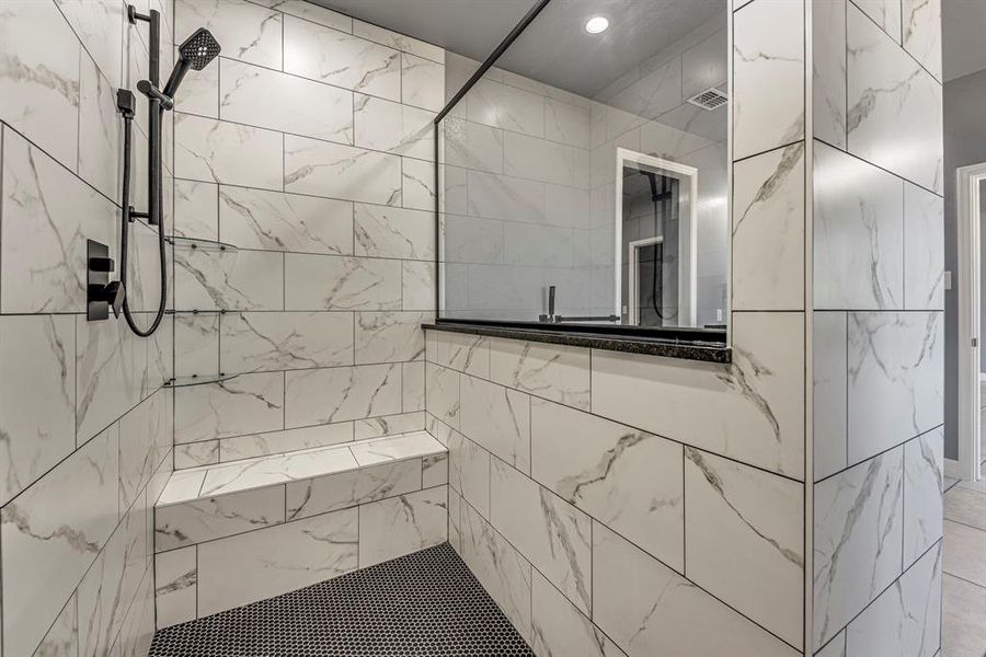 Bathroom featuring tiled shower