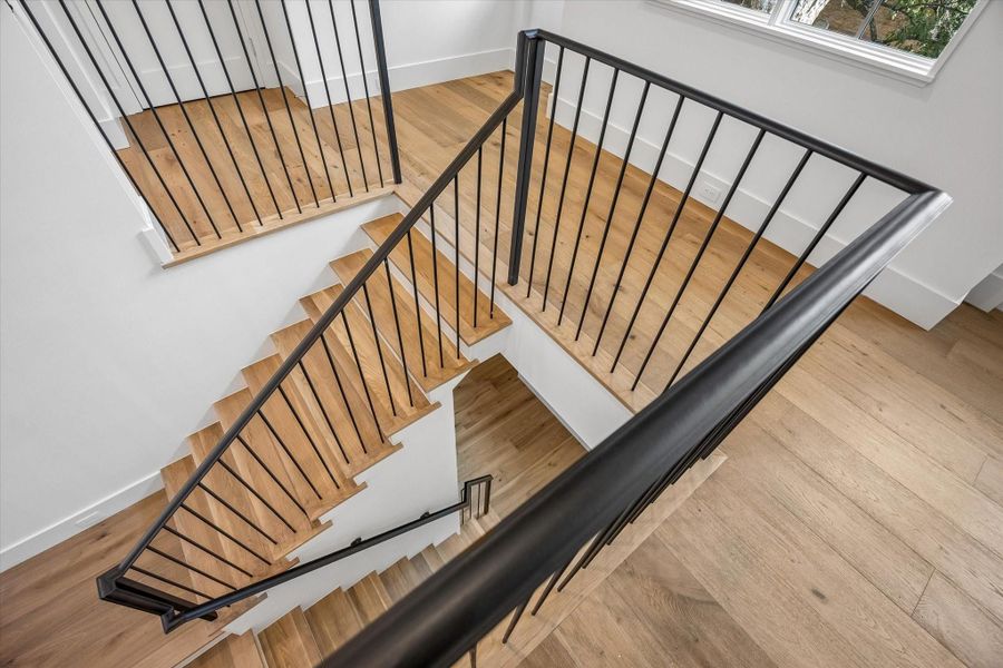 Handsome grand staircase with iron railing Handsome grand staircase with iron railing
