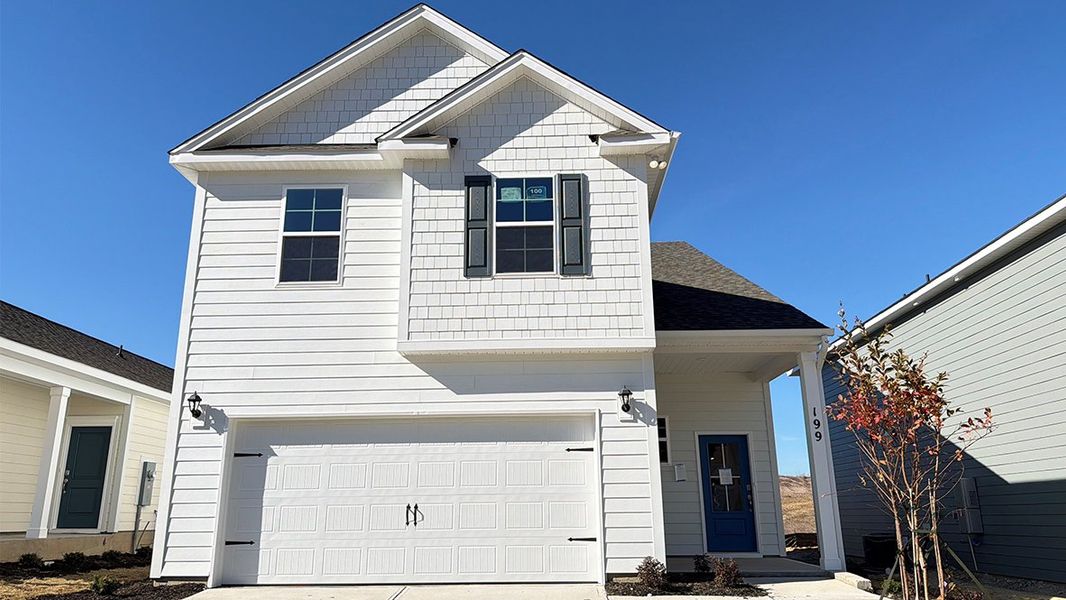 Front exterior of a new home in Livingston Woods, Irmo, SC, highlighting curb appeal (Image 2).