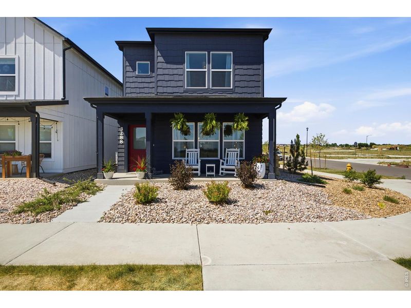 Front exterior of a new home in Bloom, Fort Collins, CO, highlighting curb appeal (Image 20).