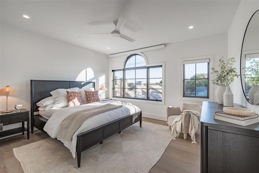 Bedroom with ceiling fan and dark hardwood / wood-style flooring