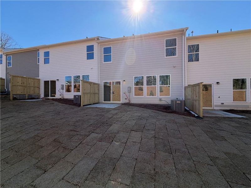 Exterior details and patio area of a home in Villas at Dawsonville Townhomes, Dawsonville (Image 2).
