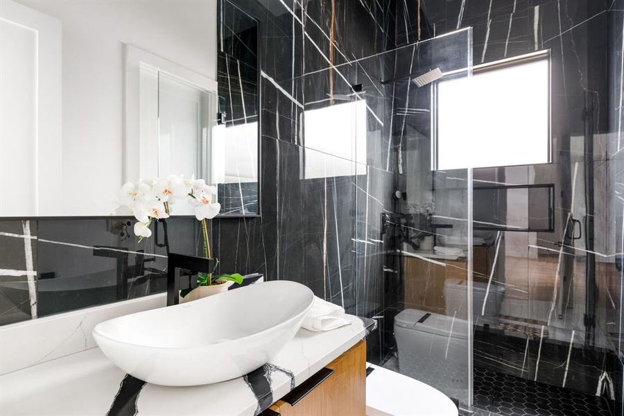 Bathroom with vanity and a stall shower Bathroom with vanity and a stall shower