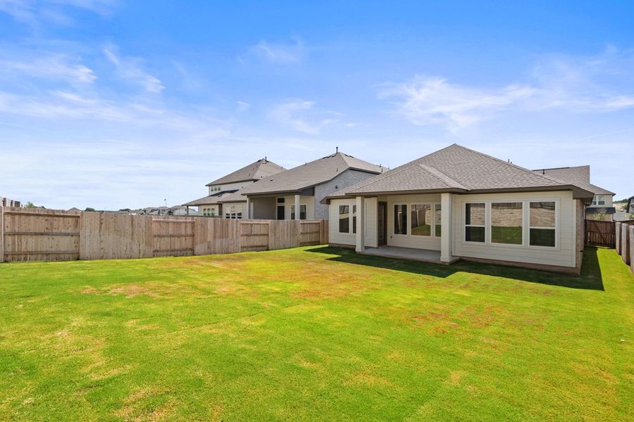 Front exterior of a new home in Park Collection at Lariat, Liberty Hill, TX, highlighting curb appeal (Image 24). Front exterior of a new home in Park Collection at Lariat, Liberty Hill, TX, highlighting curb appeal (Image 24).