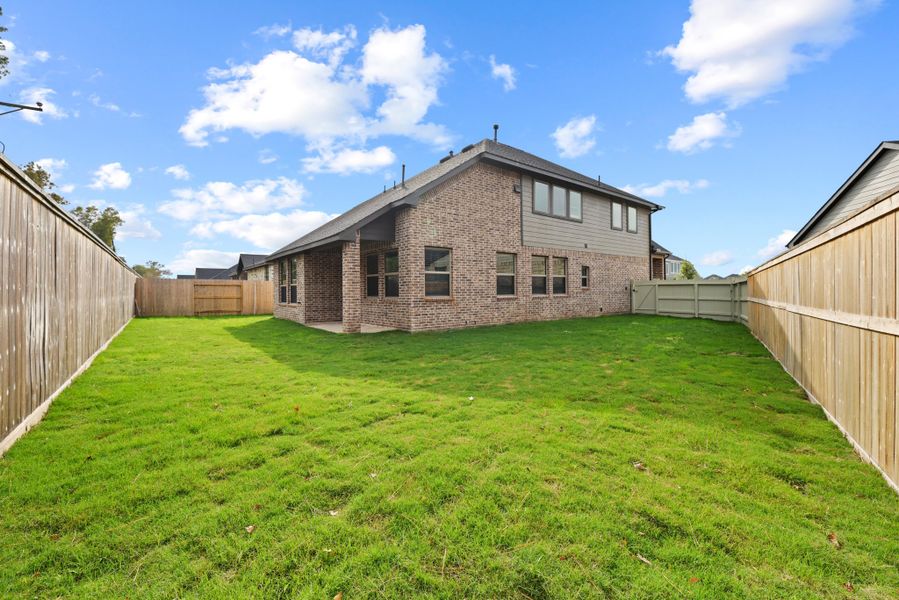 Exterior details and patio area of a home in The Woodlands Hills, Willis (Image 28). Exterior details and patio area of a home in The Woodlands Hills, Willis (Image 28).