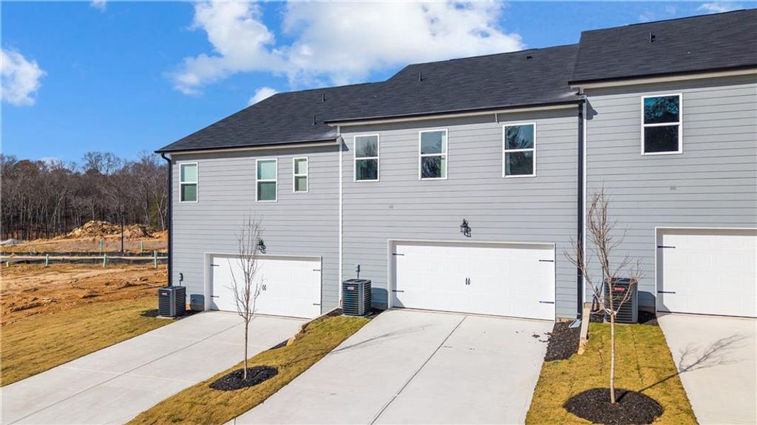 Front exterior of a new home in , Conyers, GA, highlighting curb appeal (Image 25).