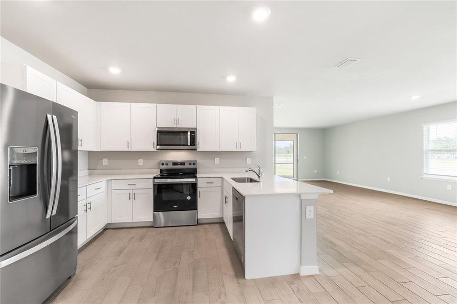 Furnished interior view inside a new home in Cove at West Port - Tradition, Port Charlotte (Image 28).