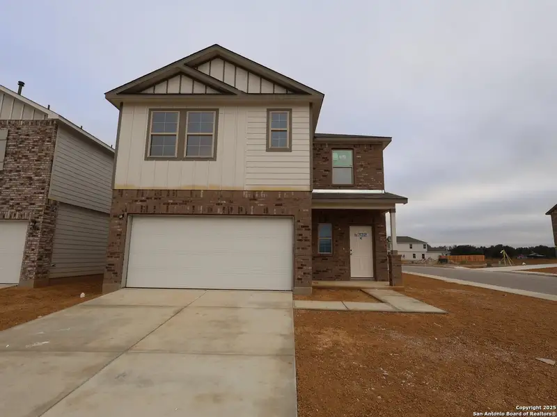 Front exterior of a new home in Winding Brook, San Antonio, TX, highlighting curb appeal (Image 1). Front exterior of a new home in Winding Brook, San Antonio, TX, highlighting curb appeal (Image 1).
