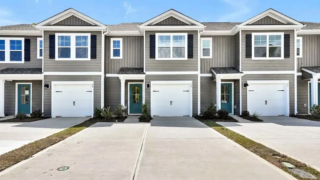 Front exterior of a new home in The Willows at Blake Farm, Wilmington, NC, highlighting curb appeal (Image 1). Front exterior of a new home in The Willows at Blake Farm, Wilmington, NC, highlighting curb appeal (Image 1).